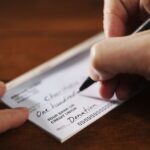 Writing a donation check to a charitable organization